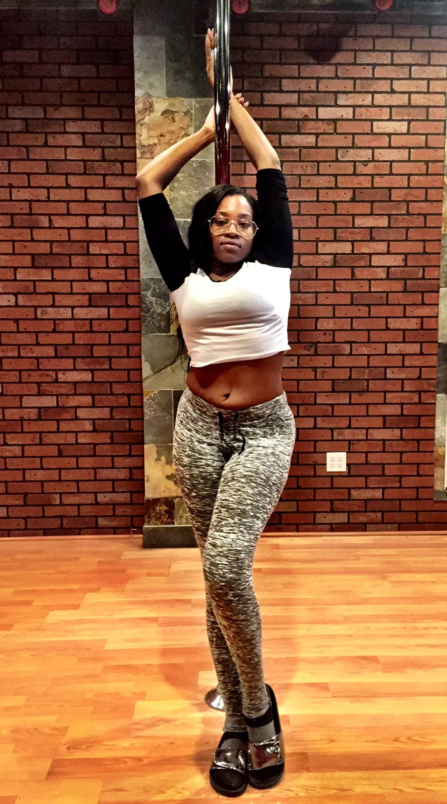 Arania mid-pose on the pole in Las Vegas